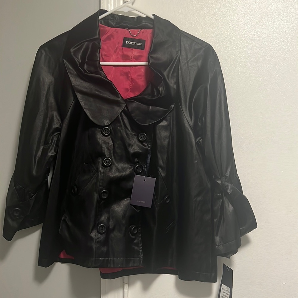 Black silky jacket long sleeve Buttons down front and buttons on the sleeves.